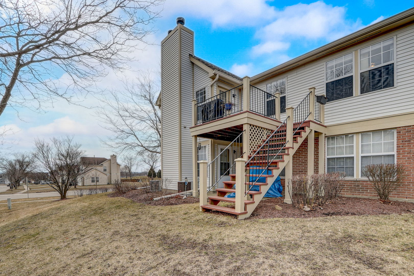 628 Village Road, Unit B Crystal Lake, IL 60014 - Photo 31 of 33 a view of a house with a yard