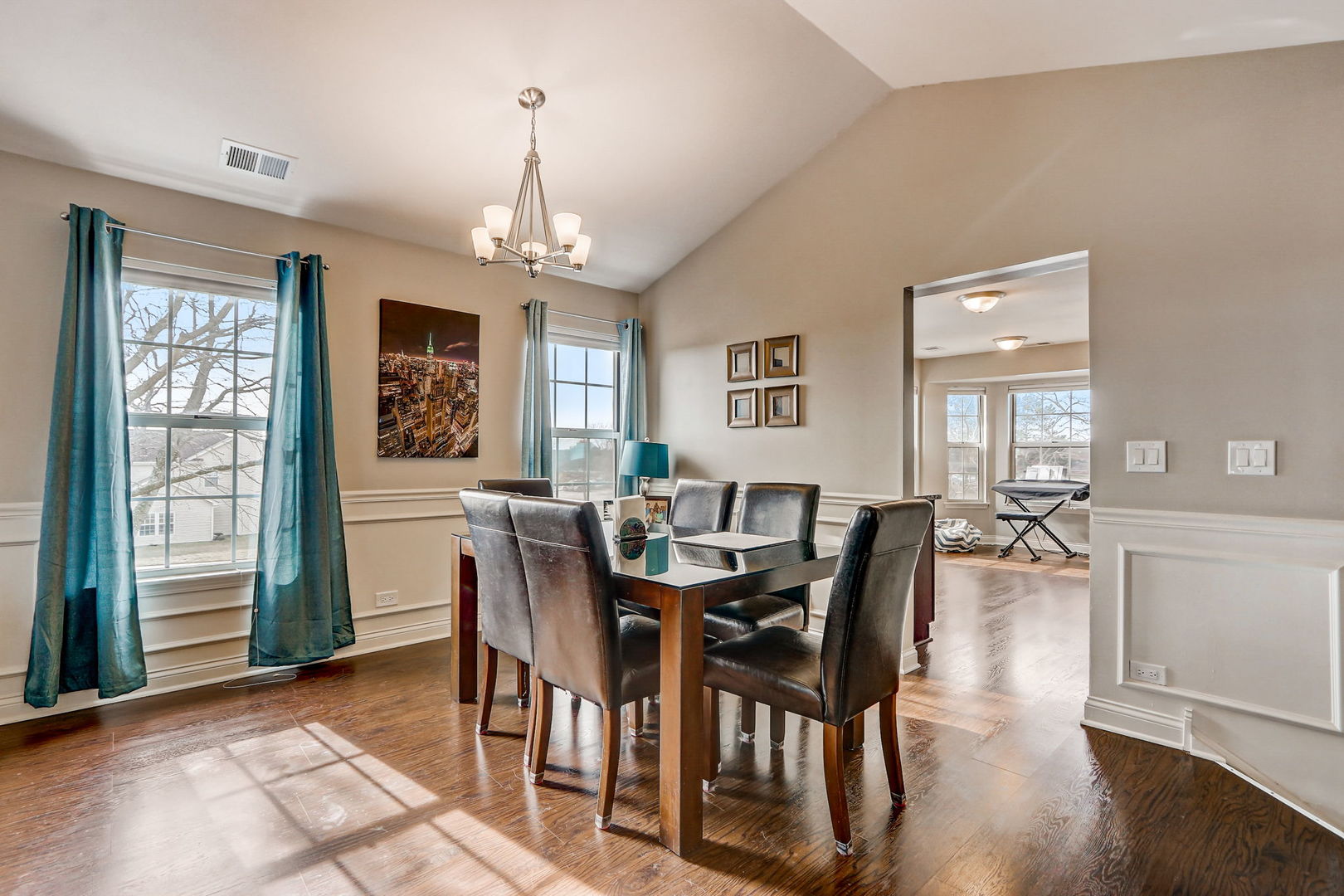 628 Village Road, Unit B Crystal Lake, IL 60014 - Photo 5 of 33 a view of a dining room with furniture window and wooden floor