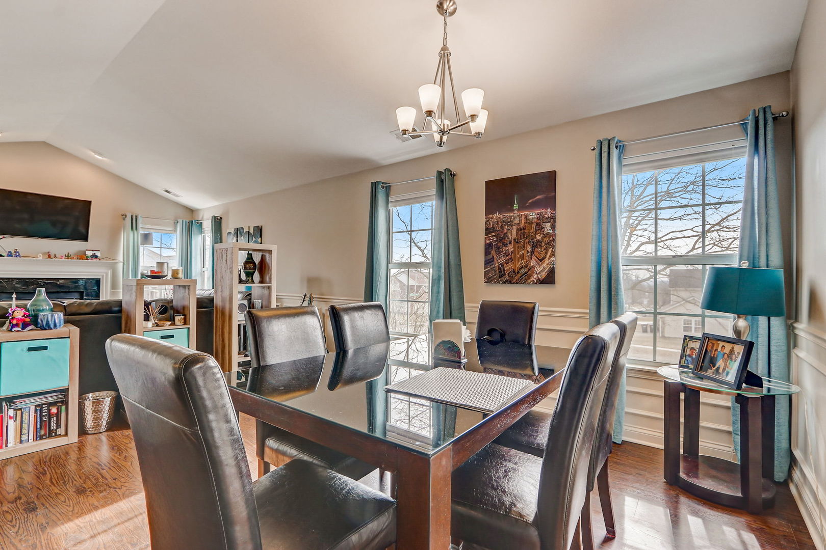 628 Village Road, Unit B Crystal Lake, IL 60014 - Photo 7 of 33 a view of a dining room with furniture window and wooden floor