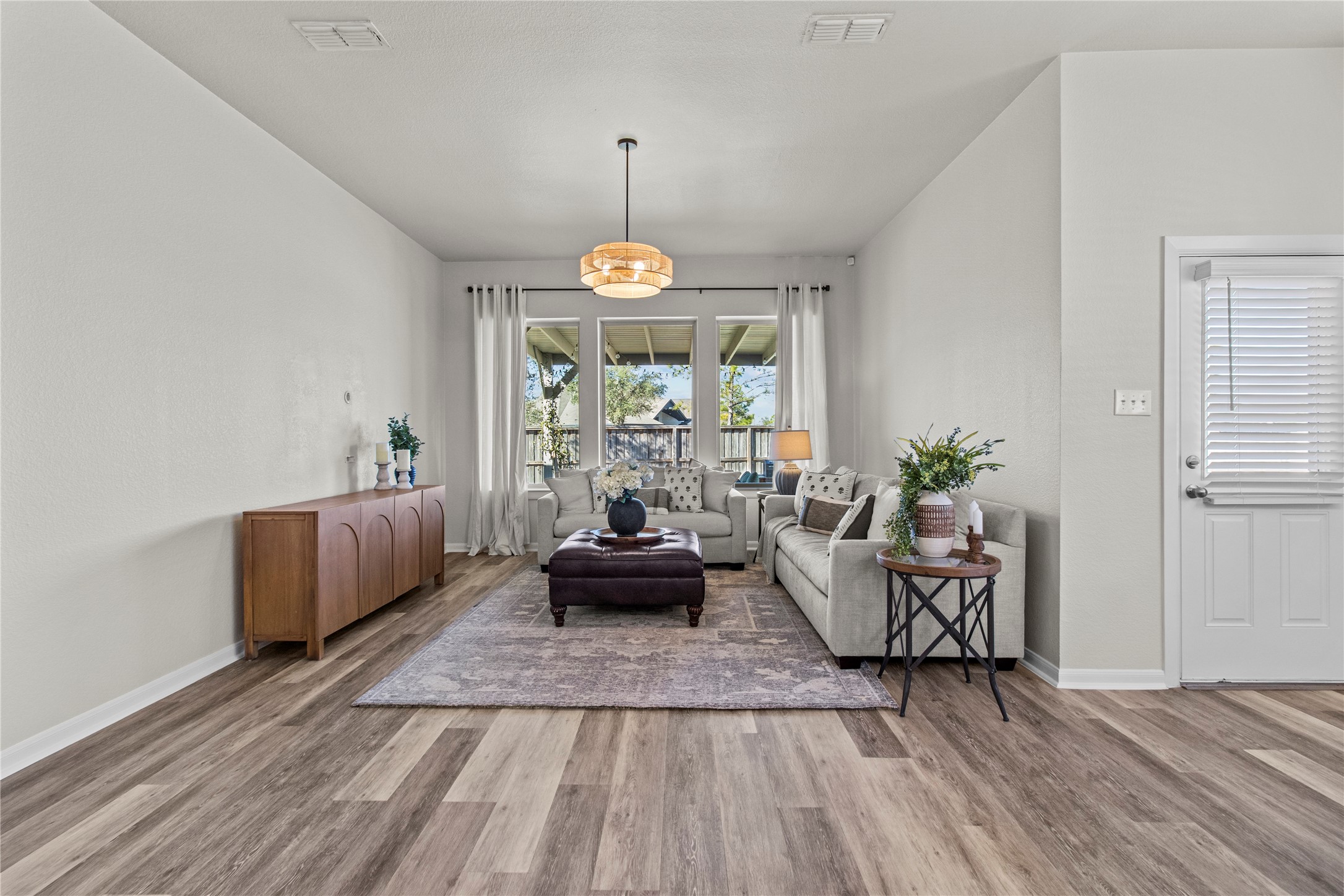 10010 Napier Drive Rosharon, TX 77583 - Photo 11 of 38 Living space with large windows overlooking backyard