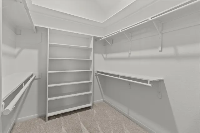 a view of an empty walk in closet