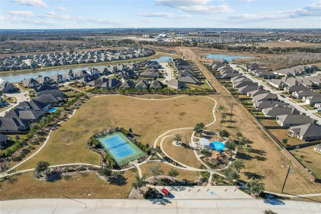 a view of a swimming pool with outdoor seating