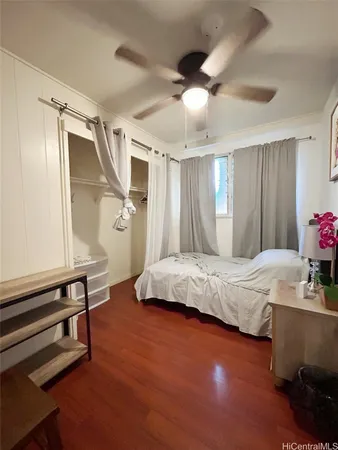 a bedroom with a bed and a dresser