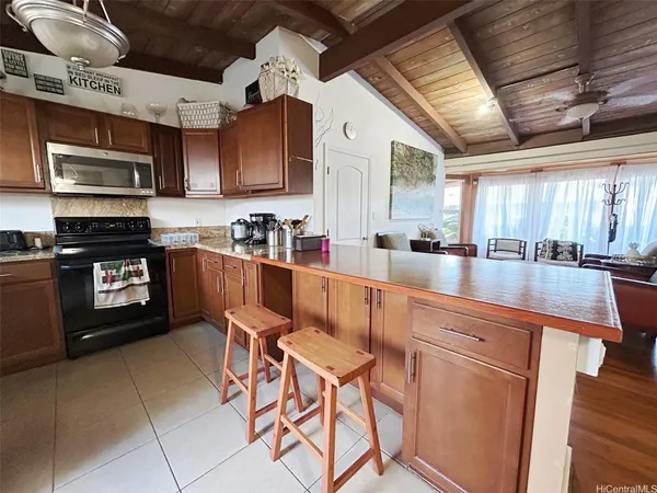 a kitchen with stainless steel appliances granite countertop a sink and cabinets