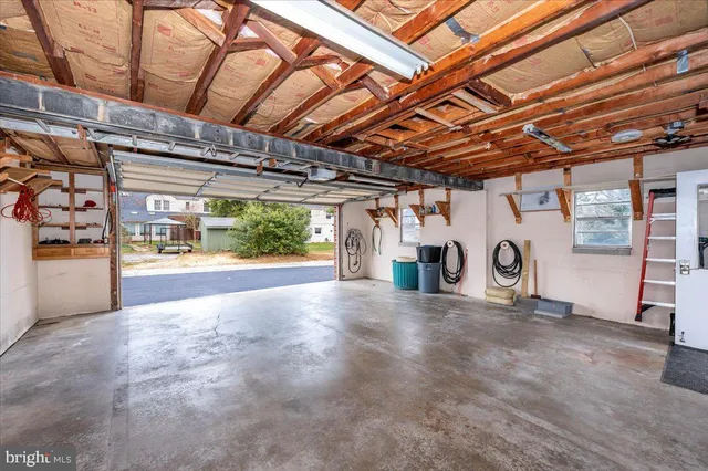 a view of a water heater room with a garage