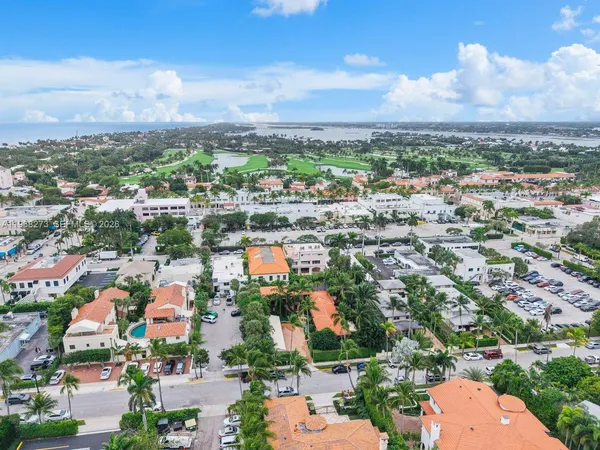 an aerial view of residential building with yard