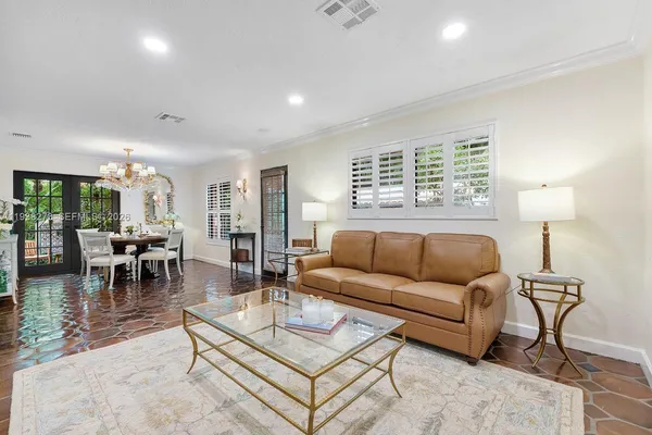 a living room with furniture and a table