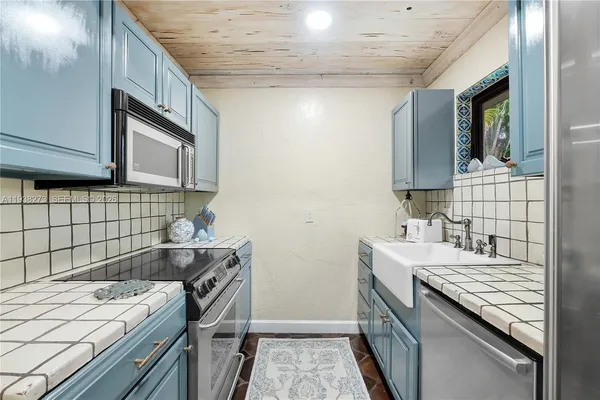 a kitchen with a stove and a sink