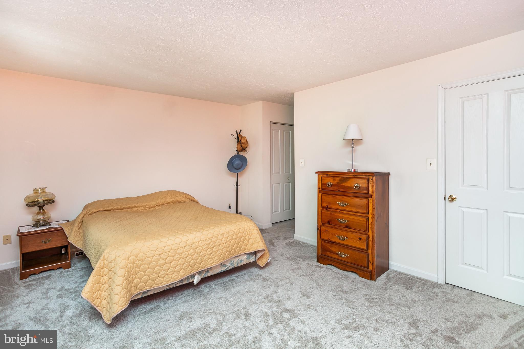 615 Nollmeyer Road Baltimore, MD 21220 - Photo 19 of 46 a bedroom with a bed and a cabinets