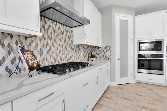 a work room with furniture and a potted plant