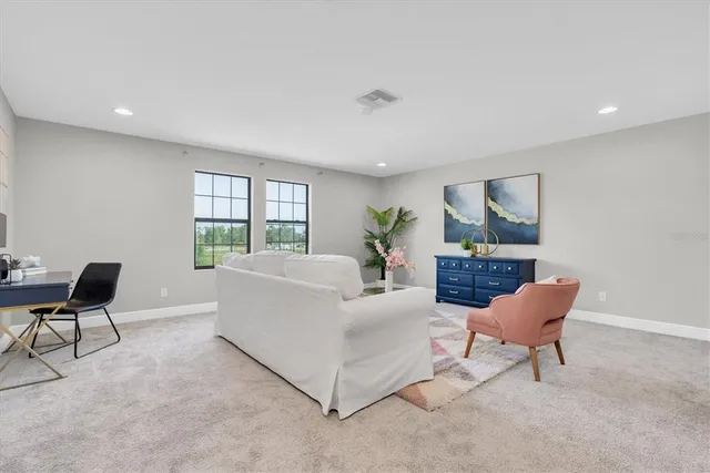 a bedroom with furniture and a dresser