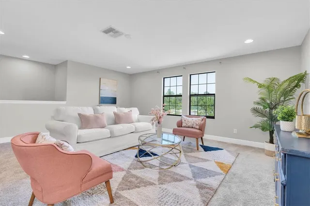 a bedroom with furniture and a window