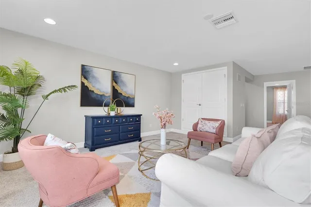 a view of a dining room with furniture and windows