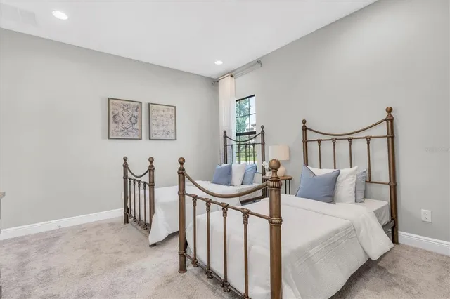 a bathroom with a granite countertop sink a toilet a mirror and shower