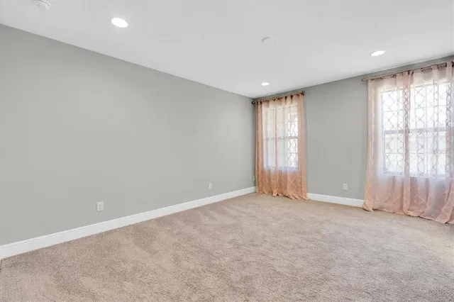 a view of swimming pool with a table and chairs next to yard