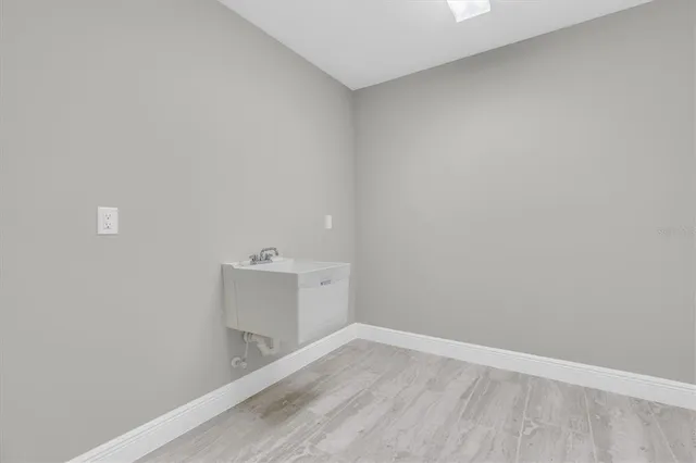 a view of a house with a backyard and a patio