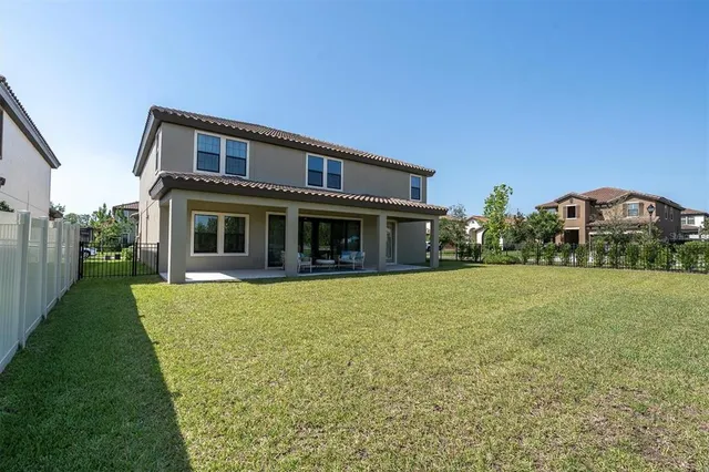an aerial view of a house with a swimming pool