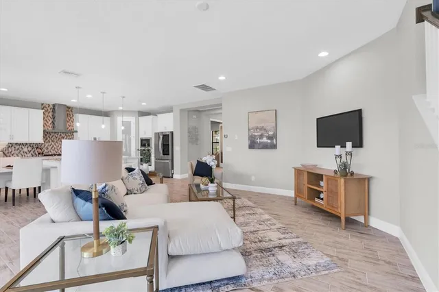 a kitchen with kitchen island granite countertop a table and chairs in it