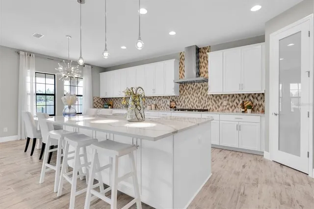 a kitchen with kitchen island granite countertop lots of counter top space and appliances