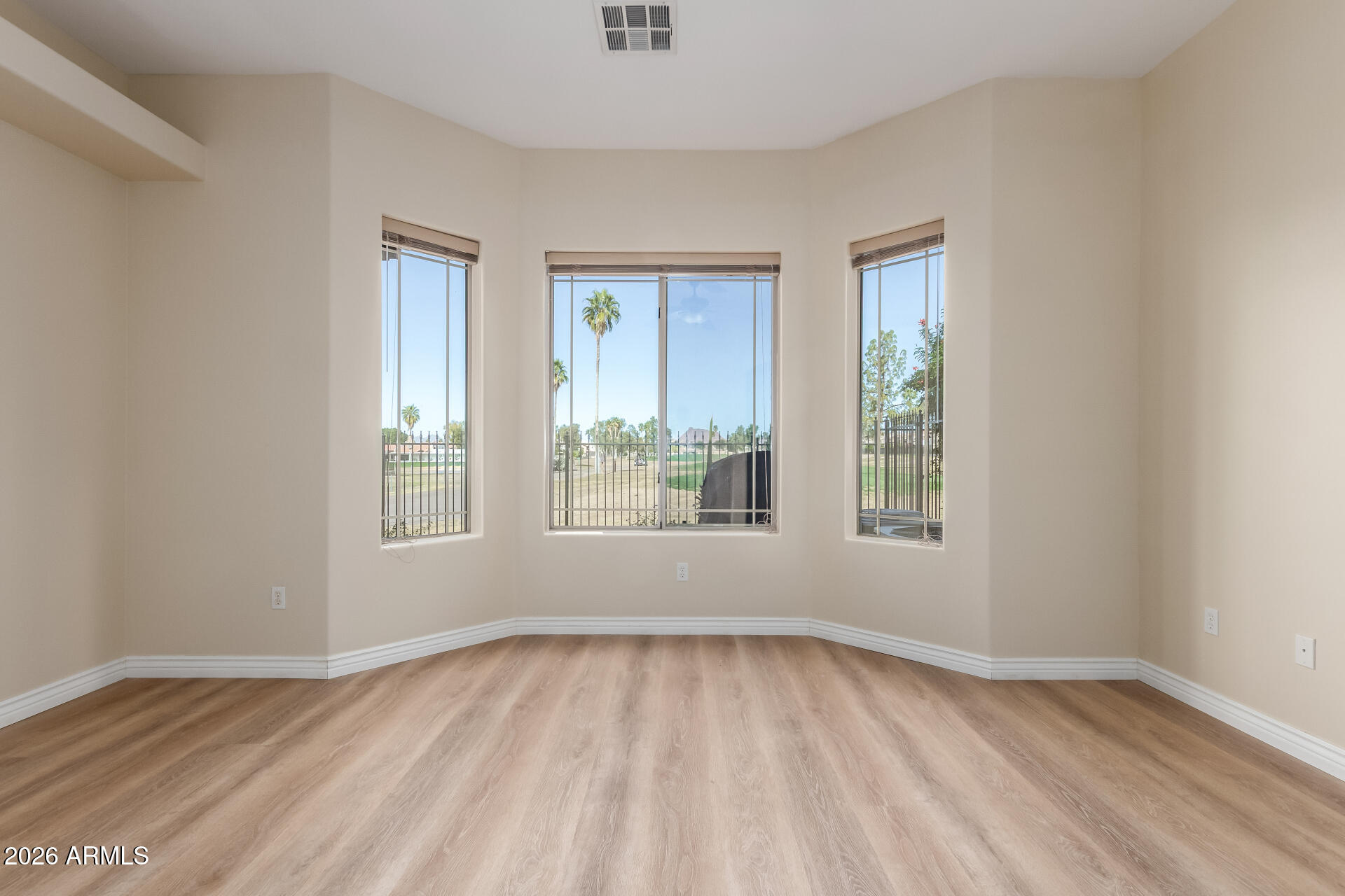 6202 East McKellips Road, Unit 115 Mesa, AZ 85215 - Photo 11 of 43 an empty room with a window