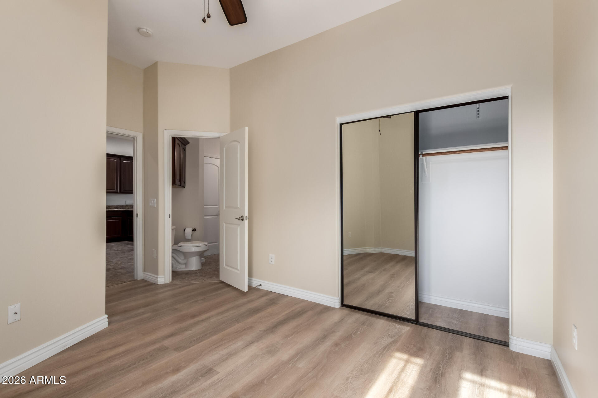 6202 East McKellips Road, Unit 115 Mesa, AZ 85215 - Photo 15 of 43 an empty room with closet and wooden floor