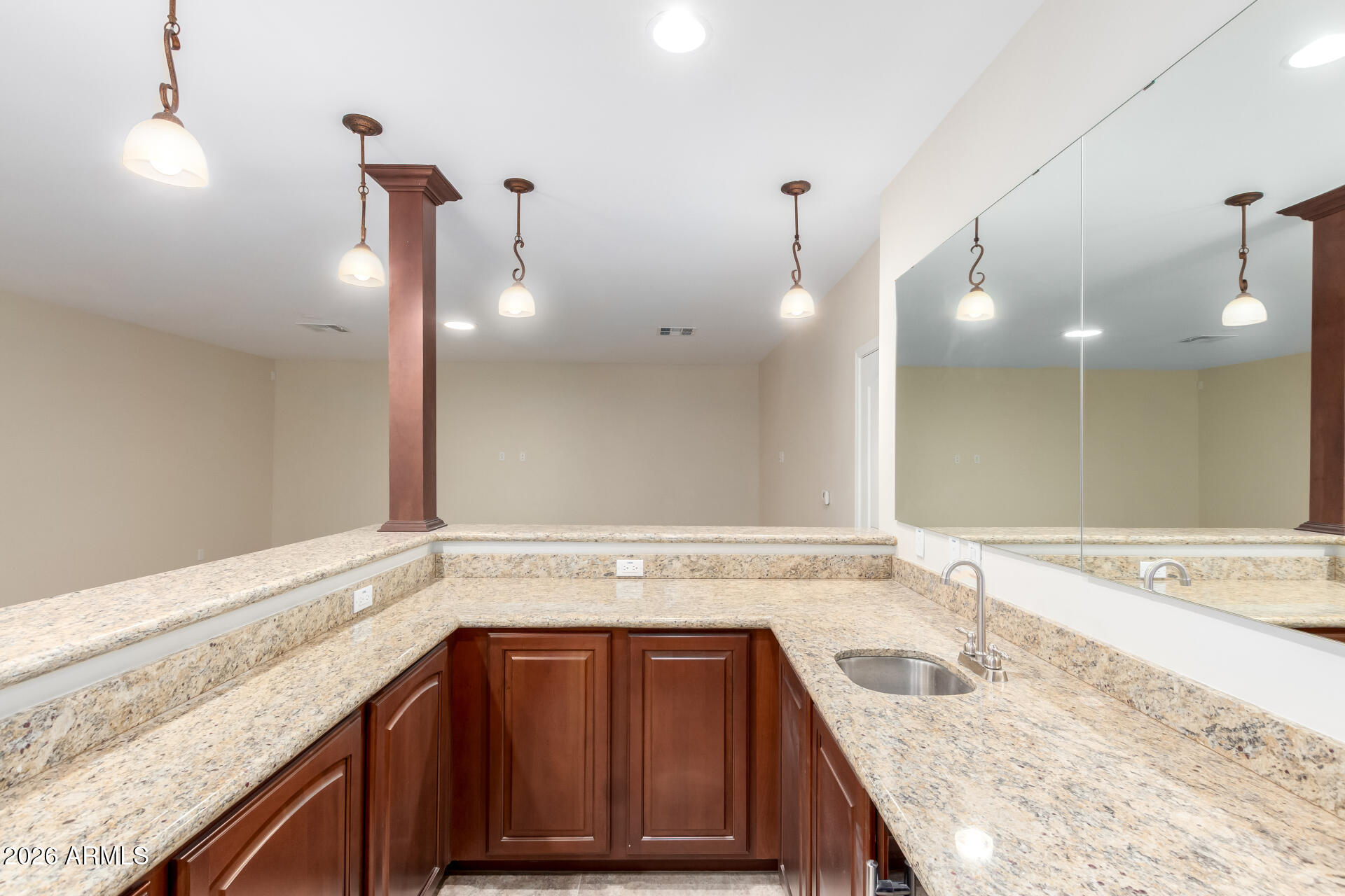 6202 East McKellips Road, Unit 115 Mesa, AZ 85215 - Photo 22 of 43 a bathroom with a granite countertop sink and mirror