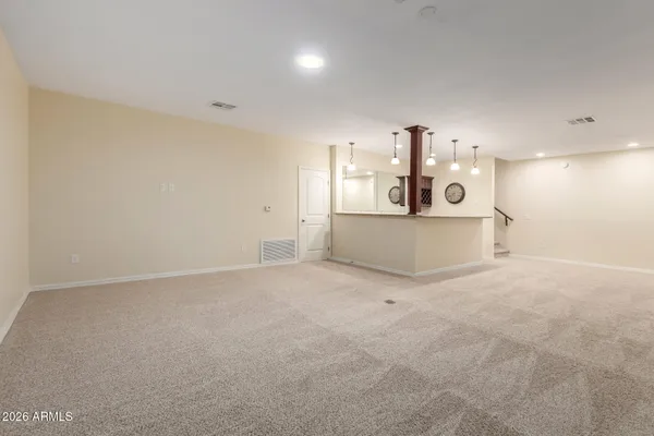 a view of a kitchen with a sink and cabinets
