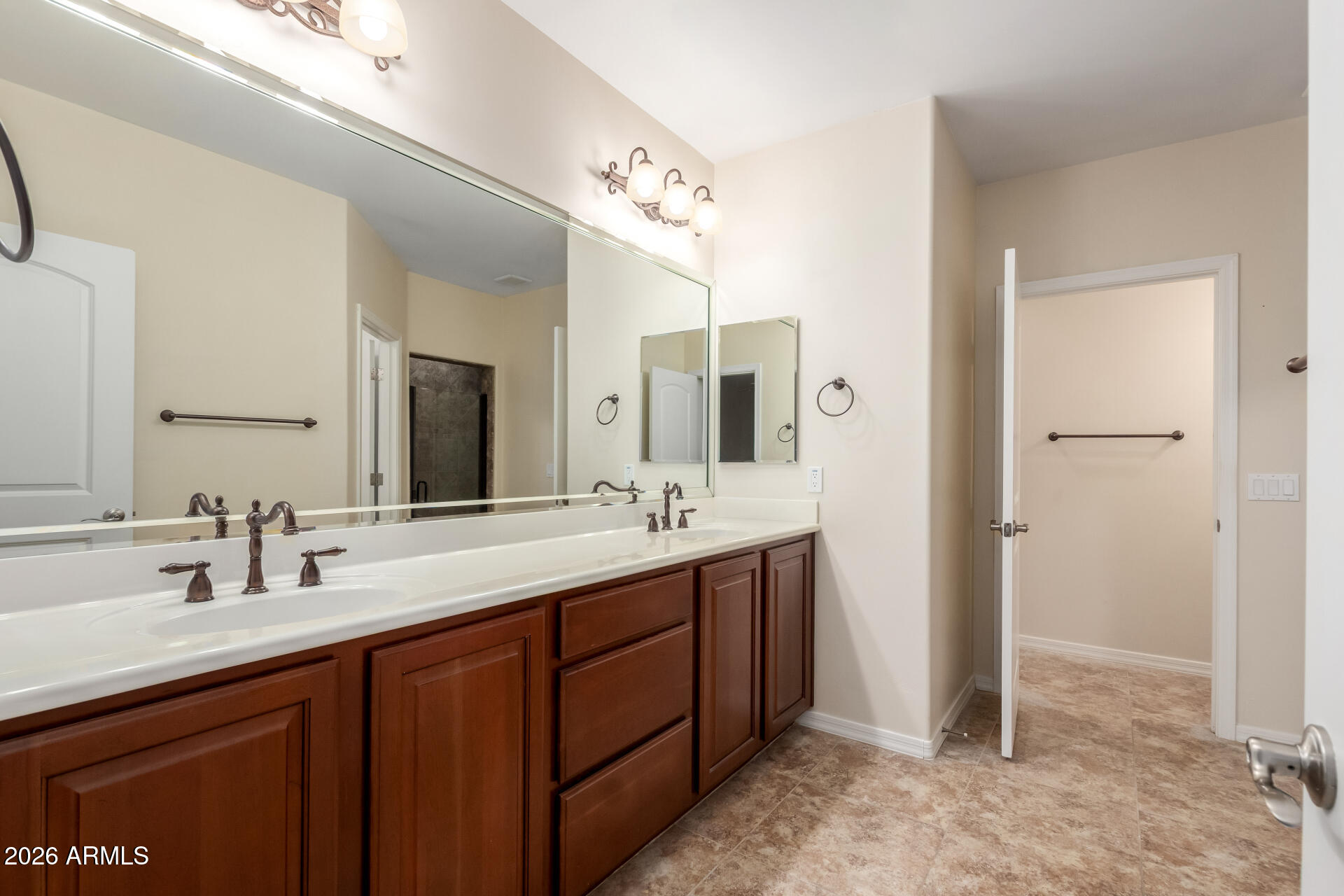 6202 East McKellips Road, Unit 115 Mesa, AZ 85215 - Photo 28 of 43 a bathroom with a double vanity sink and a mirror