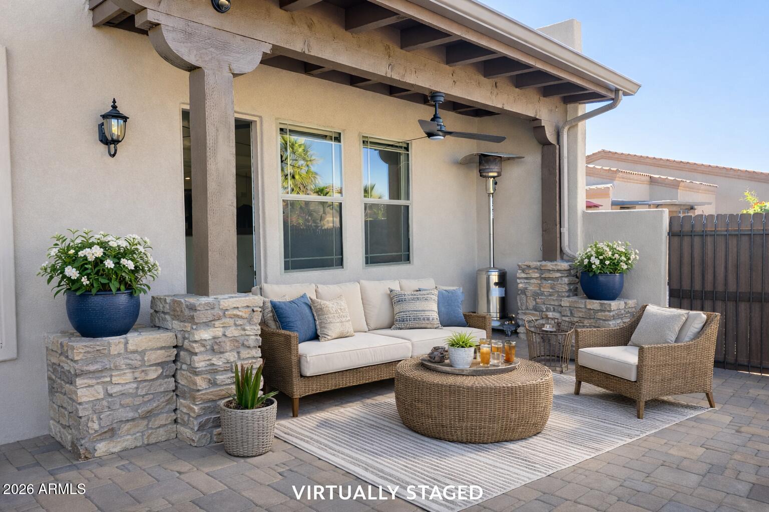 6202 East McKellips Road, Unit 115 Mesa, AZ 85215 - Photo 30 of 43 a view of a patio with couches and a potted plant