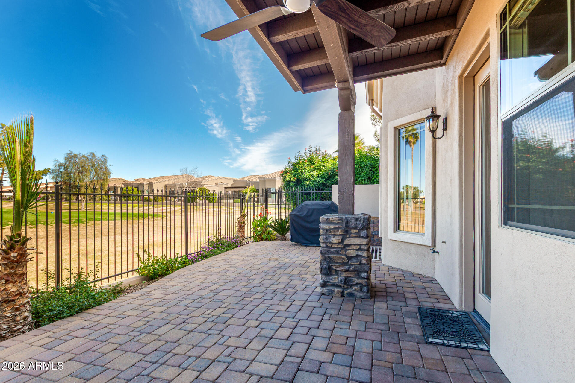 6202 East McKellips Road, Unit 115 Mesa, AZ 85215 - Photo 32 of 43 a view of a patio with a table and chairs