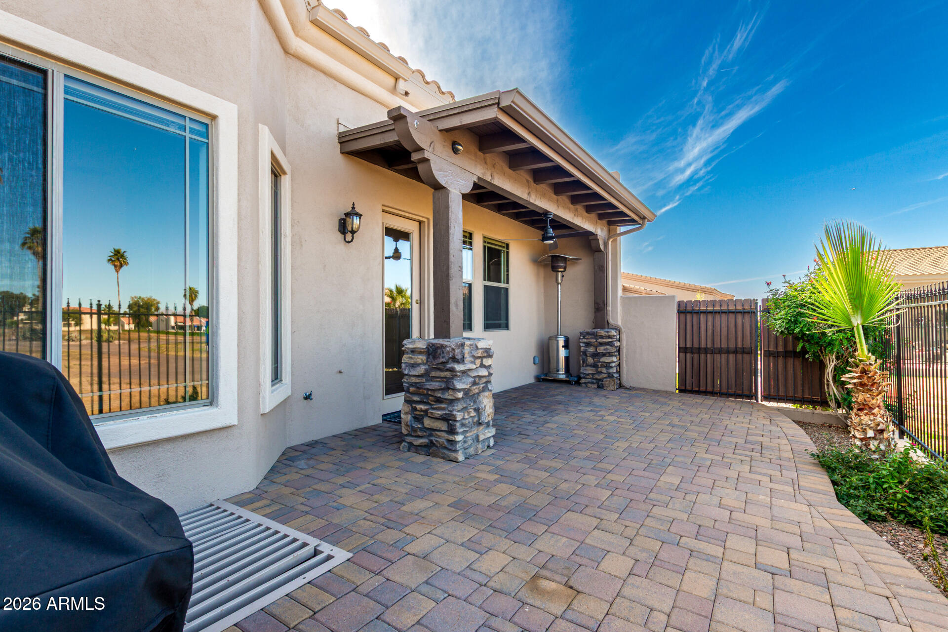 6202 East McKellips Road, Unit 115 Mesa, AZ 85215 - Photo 34 of 43 a view of a house with backyard and porch