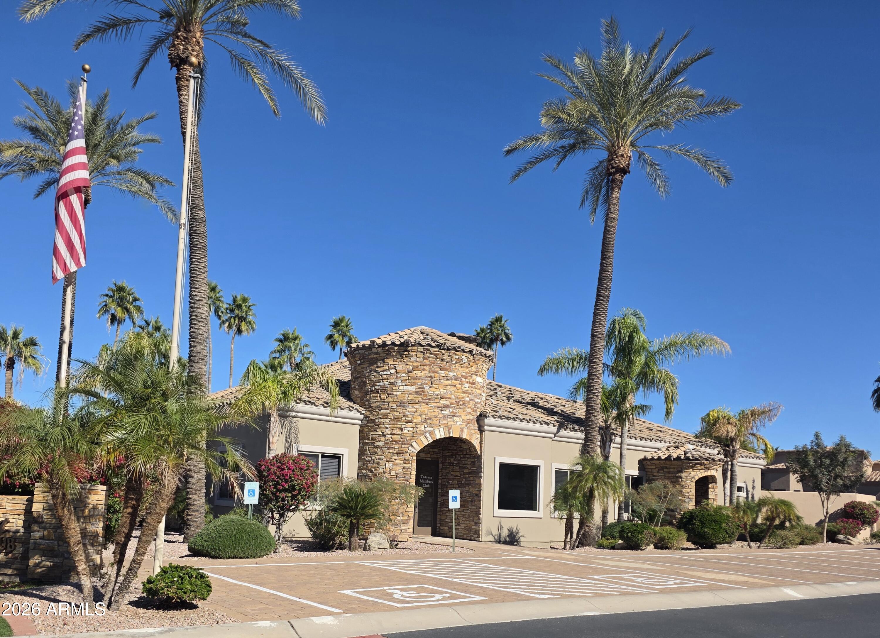 6202 East McKellips Road, Unit 115 Mesa, AZ 85215 - Photo 36 of 43 a front view of a house with a palm tree