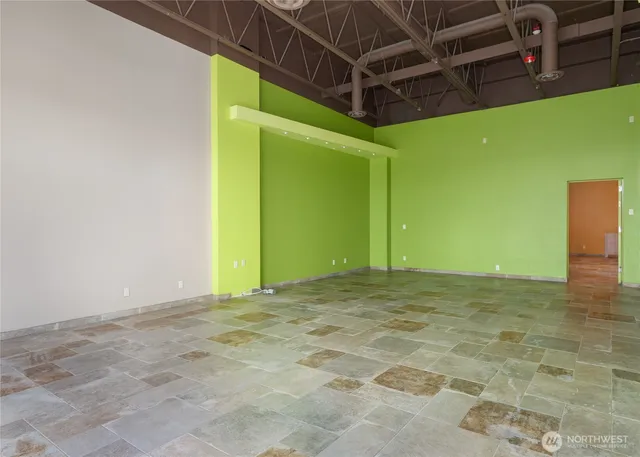 a view of a room with a wooden wall