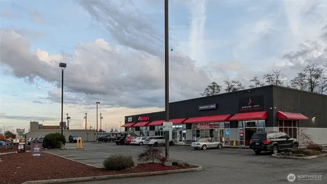 a store with outdoor seating and city view