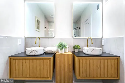 a kitchen with a sink a stove and a window