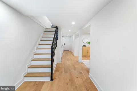 a view of entryway with wooden floor
