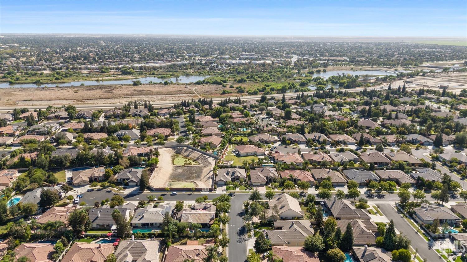 Undisclosed Address Bakersfield, CA 93312 - Photo 11 of 50 an aerial view of a city