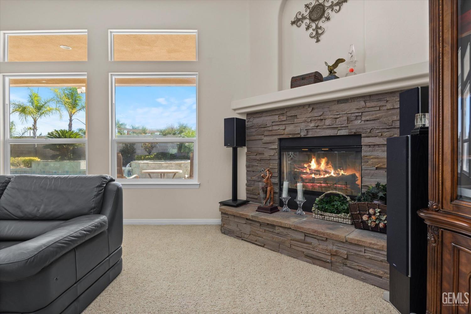 Undisclosed Address Bakersfield, CA 93312 - Photo 14 of 50 a living room with furniture and a fireplace