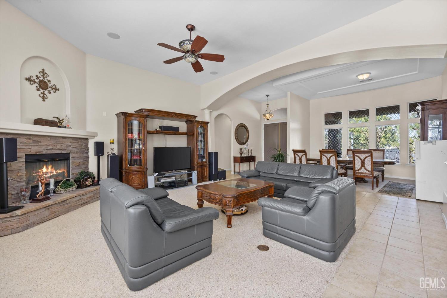 Undisclosed Address Bakersfield, CA 93312 - Photo 17 of 50 a living room with fireplace furniture and a fireplace