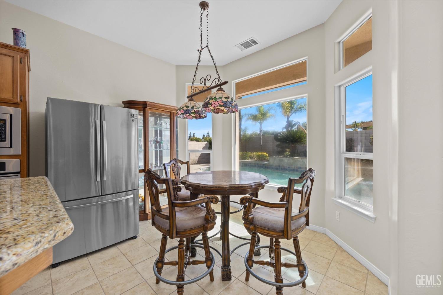 Undisclosed Address Bakersfield, CA 93312 - Photo 22 of 50 a view of a dining room with furniture window and outside view