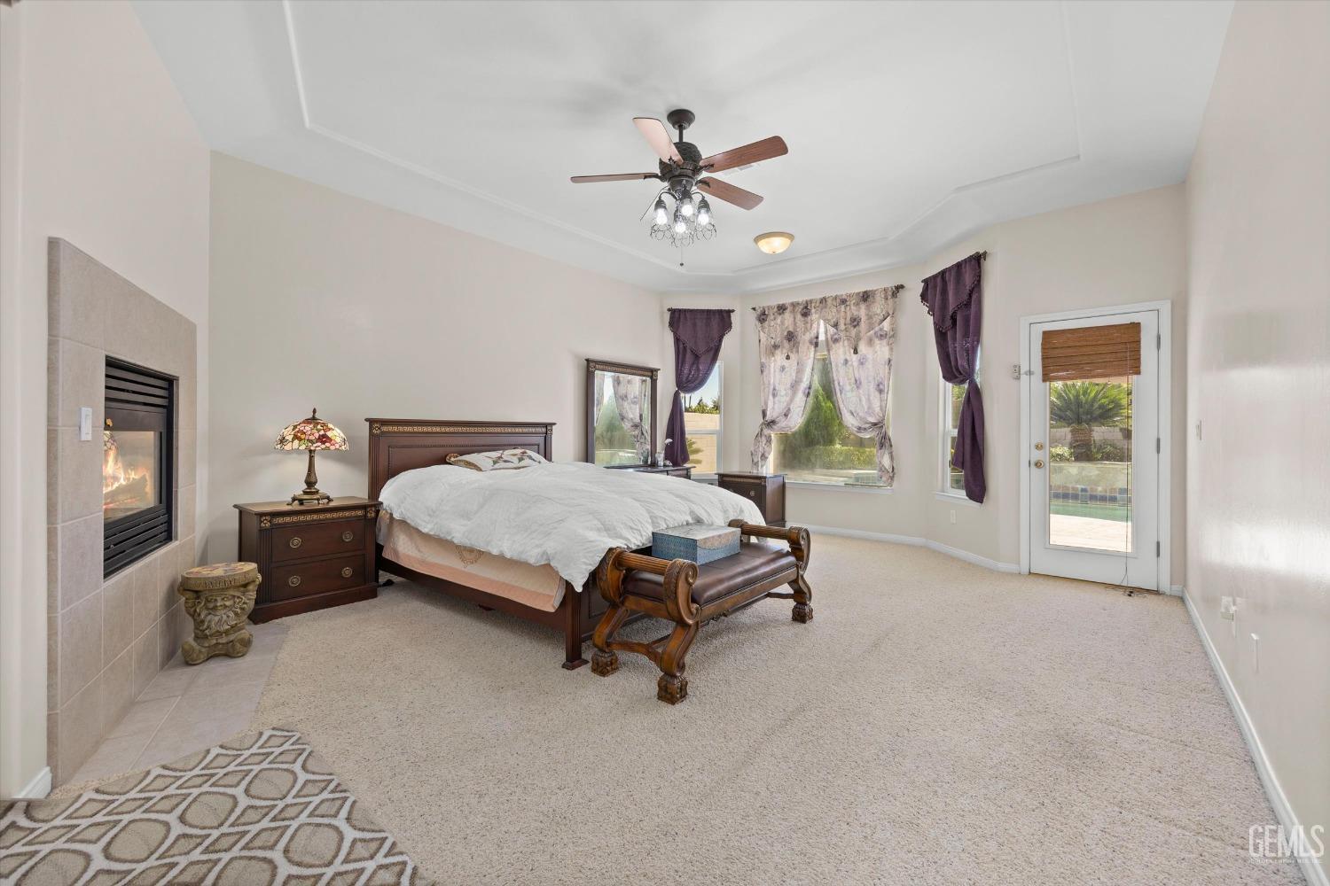 Undisclosed Address Bakersfield, CA 93312 - Photo 27 of 50 a bedroom with a bed and a chandelier