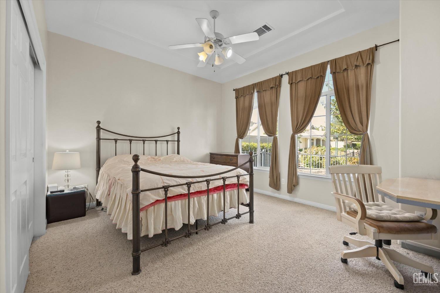 Undisclosed Address Bakersfield, CA 93312 - Photo 35 of 50 a bedroom with a bed a chair and piano