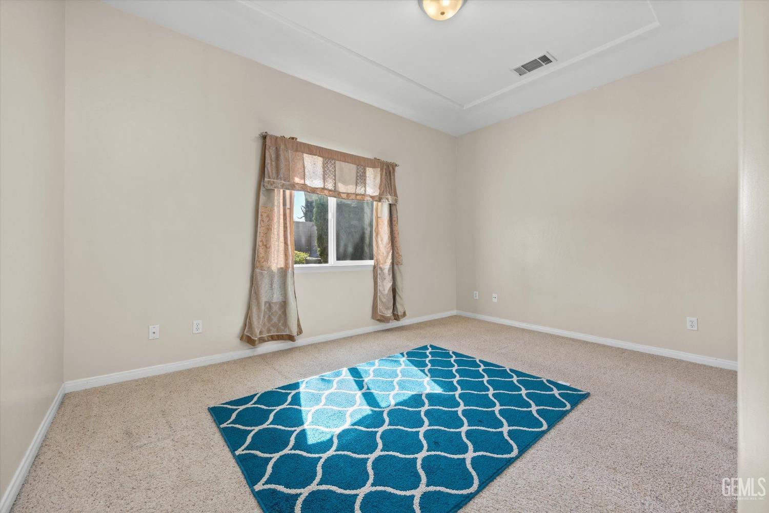 Undisclosed Address Bakersfield, CA 93312 - Photo 38 of 50 a view of an empty room with a window