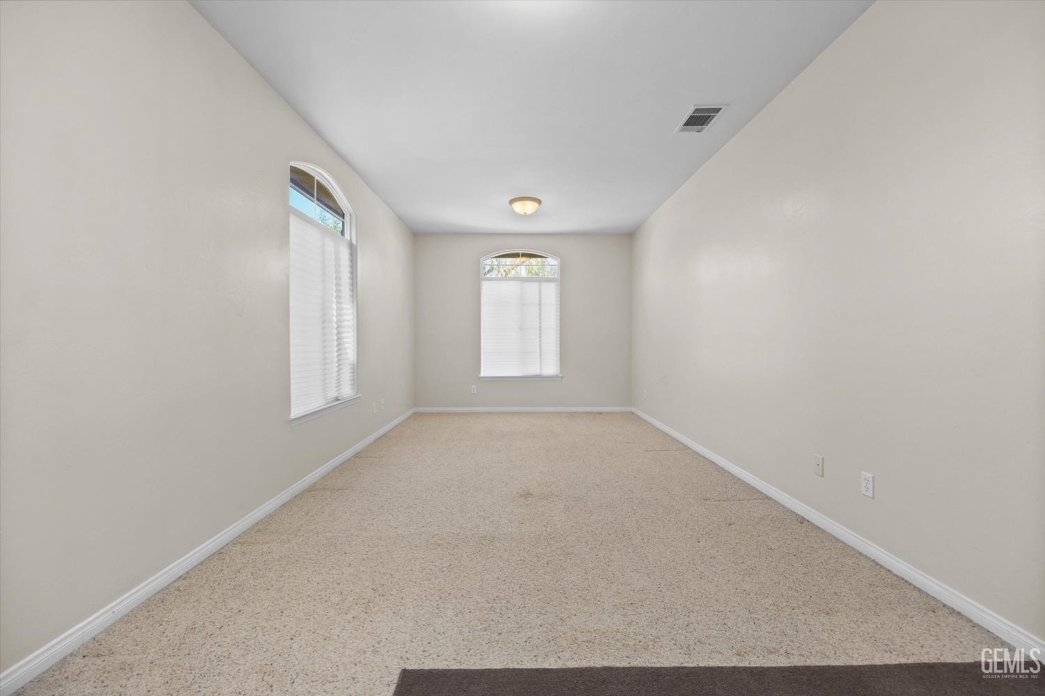 Undisclosed Address Bakersfield, CA 93312 - Photo 40 of 50 an empty room with windows