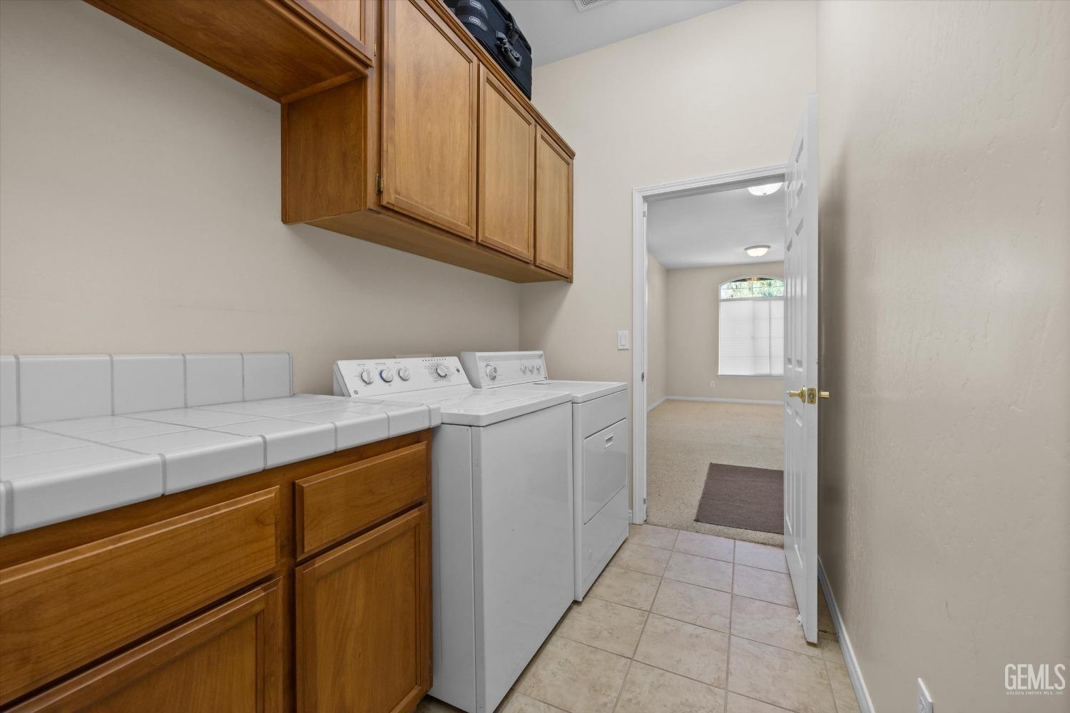 Undisclosed Address Bakersfield, CA 93312 - Photo 41 of 50 a utility room with sink dryer and washer