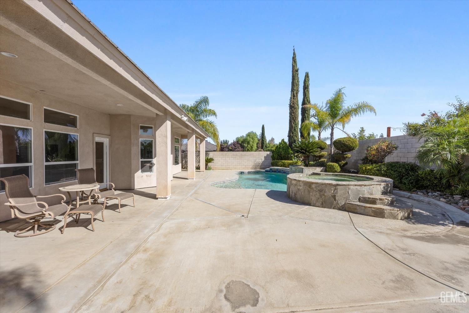Undisclosed Address Bakersfield, CA 93312 - Photo 45 of 50 a view of a house with backyard and trees