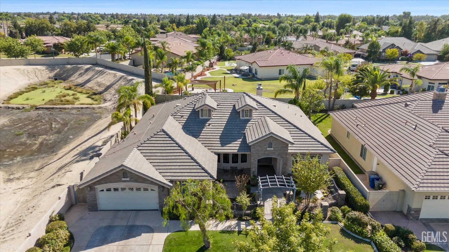 Undisclosed Address Bakersfield, CA 93312 - Photo 5 of 50 a view of a house with yard and sitting area