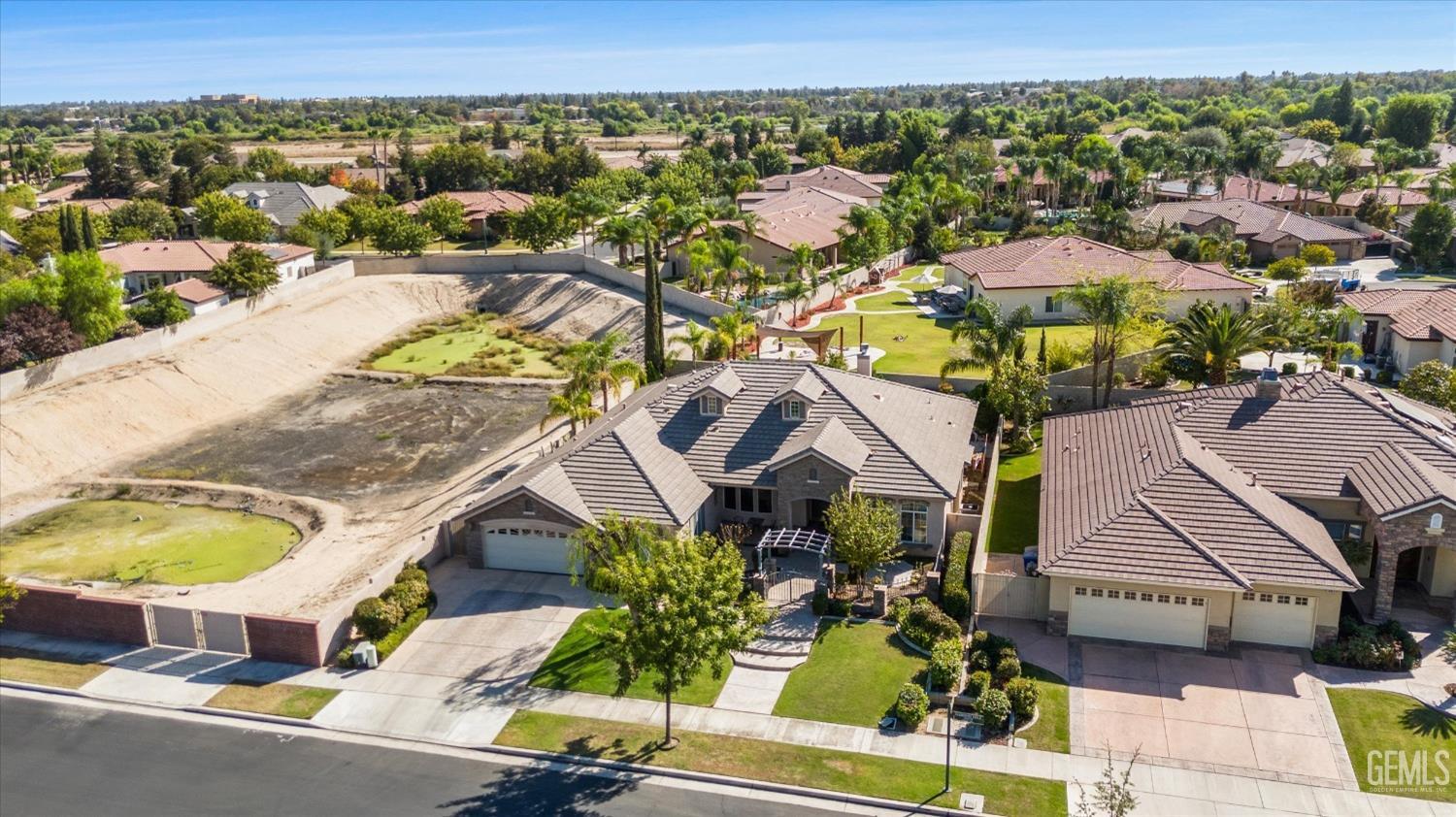 Undisclosed Address Bakersfield, CA 93312 - Photo 6 of 50 an aerial view of a house with yard swimming pool and outdoor seating