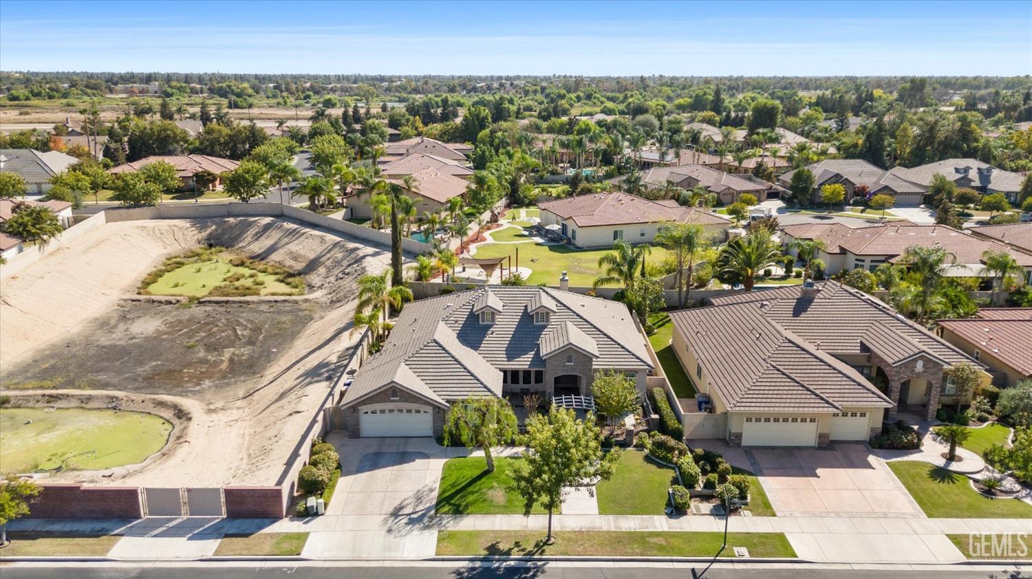 Undisclosed Address Bakersfield, CA 93312 - Photo 7 of 50 an aerial view of residential houses with outdoor space