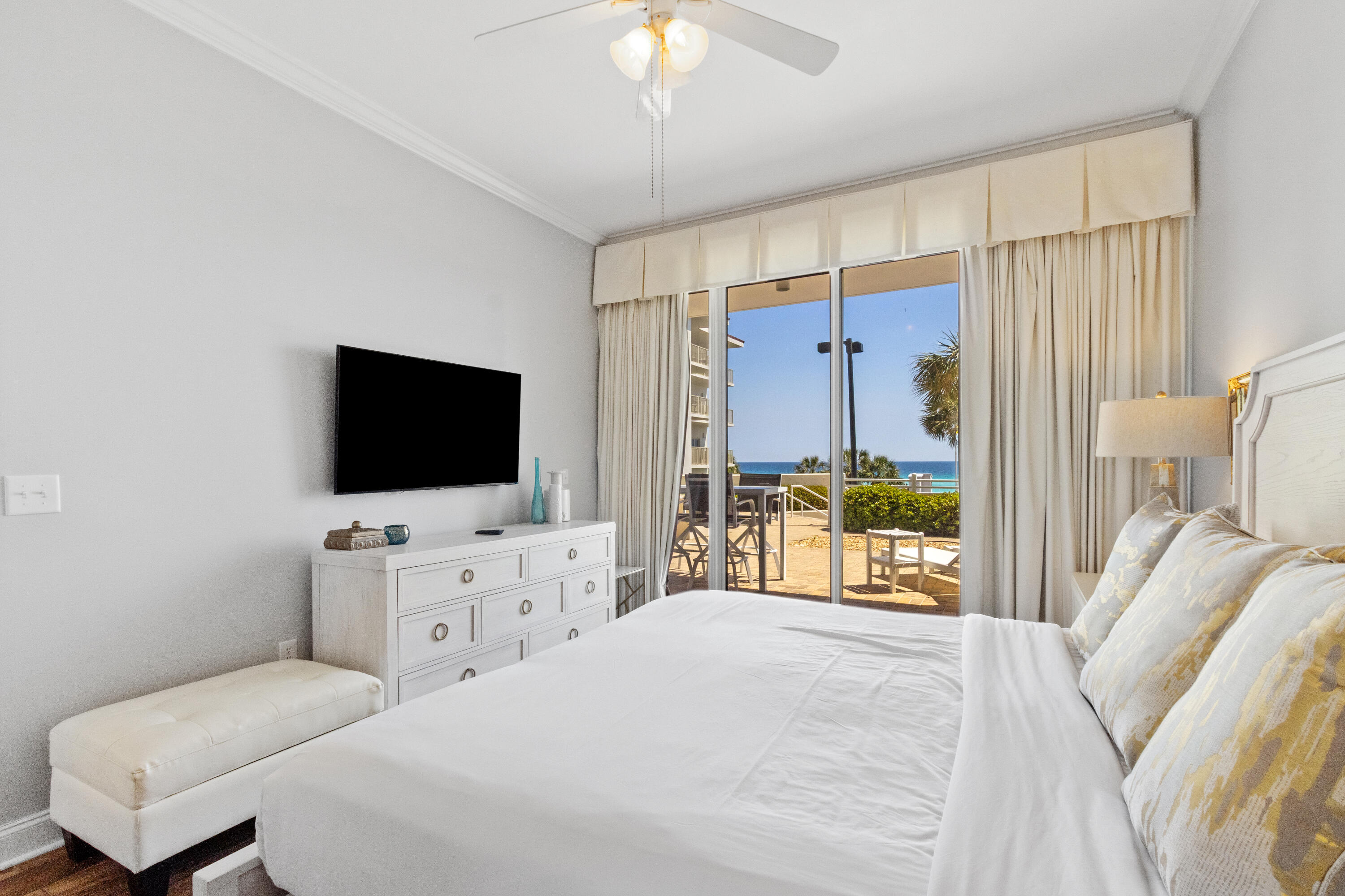 550 Tops'l Beach Boulevard, Unit 103 Miramar Beach, FL 32550 - Photo 12 of 20 a bedroom with a bed and a flat screen tv in it